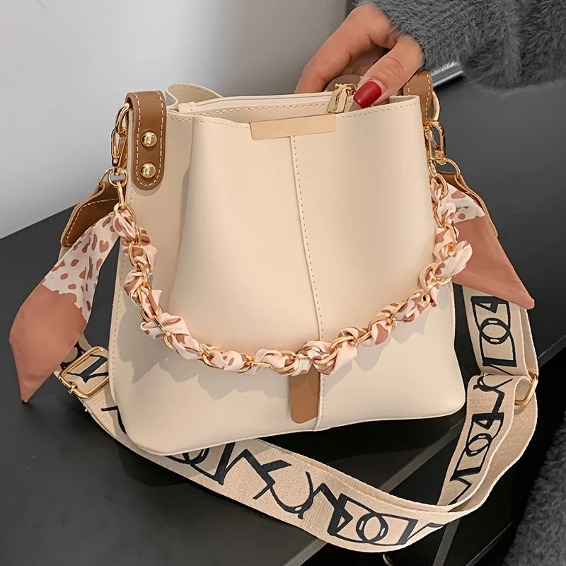 Nuevo bolso de hombro a la moda para mujer, bolso tipo cubo con cadena de cinta de gran capacidad, bolso cruzado para desplazamientos diarios