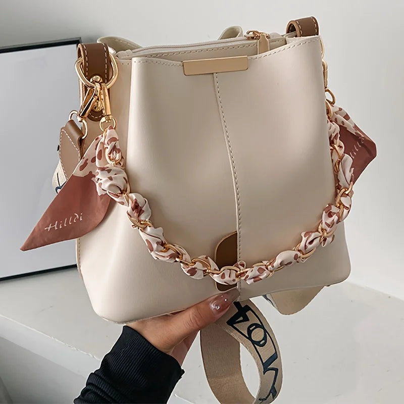 Nuevo bolso de hombro a la moda para mujer, bolso tipo cubo con cadena de cinta de gran capacidad, bolso cruzado para desplazamientos diarios
