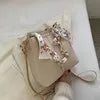 Nuevo bolso de hombro a la moda para mujer, bolso tipo cubo con cadena de cinta de gran capacidad, bolso cruzado para desplazamientos diarios